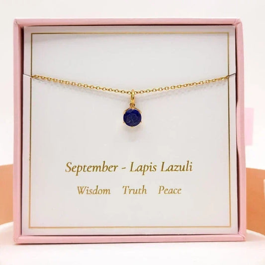 September Birthstone Necklace - Lapis Lazuli displayed in a pink gift box, featuring a deep blue lapis lazuli pendant on a gold vermeil chain