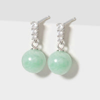 Turquoise jade drop earrings with silver-tone hoops and clear stone settings