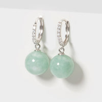 Green jade drop huggie hoop earrings with small pave details on silver-tone rings