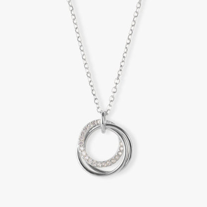 Silver ring pendant necklace with crystal pavé accents on stacked circles