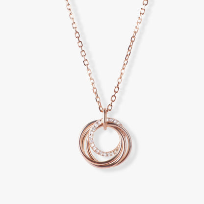 Rose gold-tone rings pendant necklace with linked chain and ring-drop charm