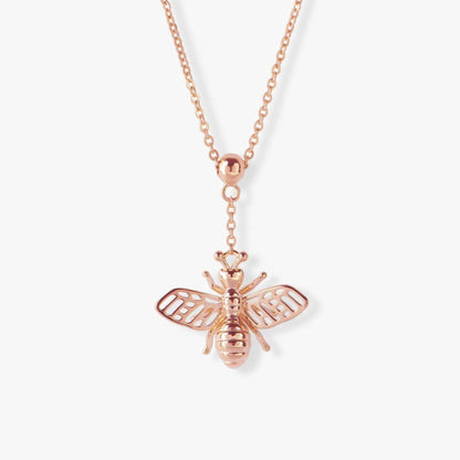 Rose gold bee pendant necklace with striped bee body and wing details