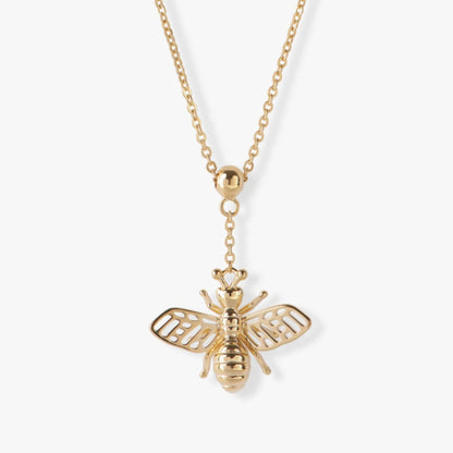Gold bee pendant necklace with round bail and layered wings on a chain