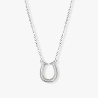 Silver horseshoe pendant necklace with pavé stones and double U-shaped charm details.