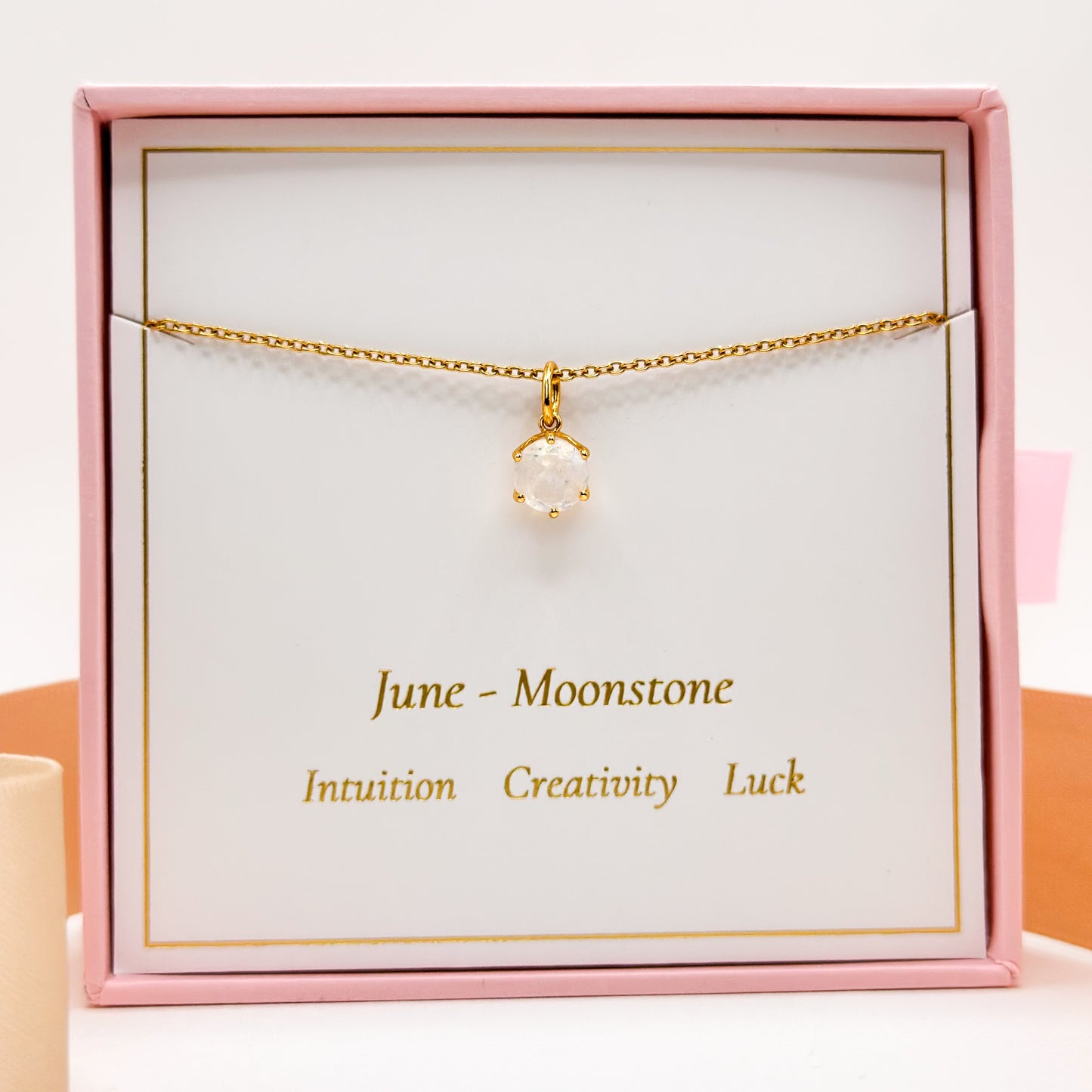Gold-tone June birthstone necklace with round moonstone charm on fine chain