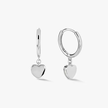 Silver heart huggie earrings with round hoop and dangling heart charm