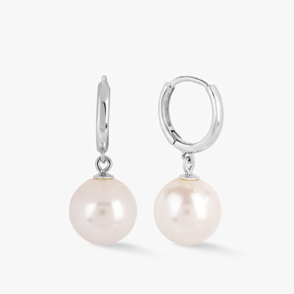 Silver pearl huggie hoop earrings with dangling white pearl drops