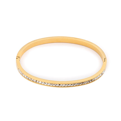 Gold hinged crystal bangle, smooth oval band lined with clear stones