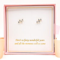 Star-shaped crystal stud earrings in silver-tone with clear stones
