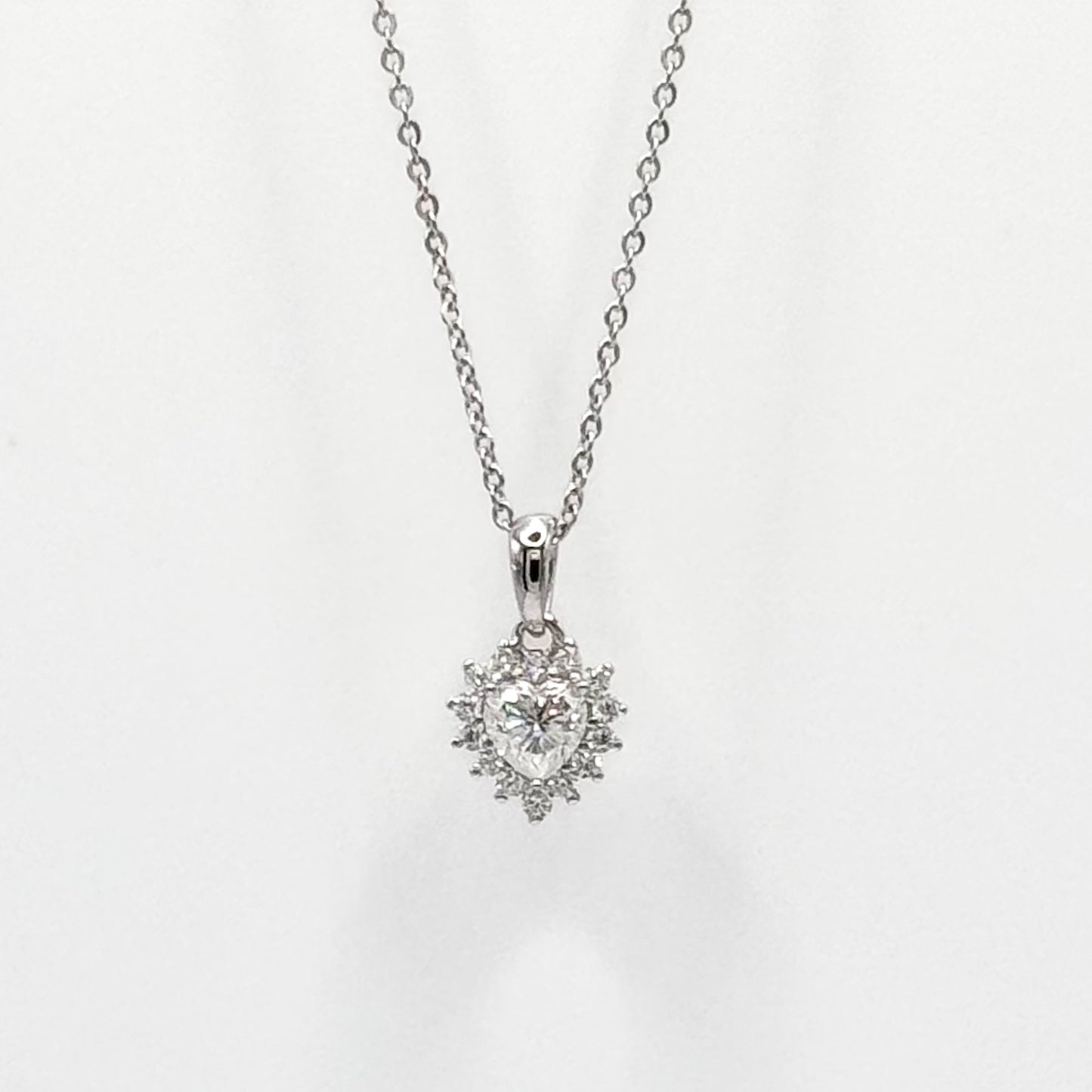 Silver-tone necklace with heart pendant and faceted stones on link chain