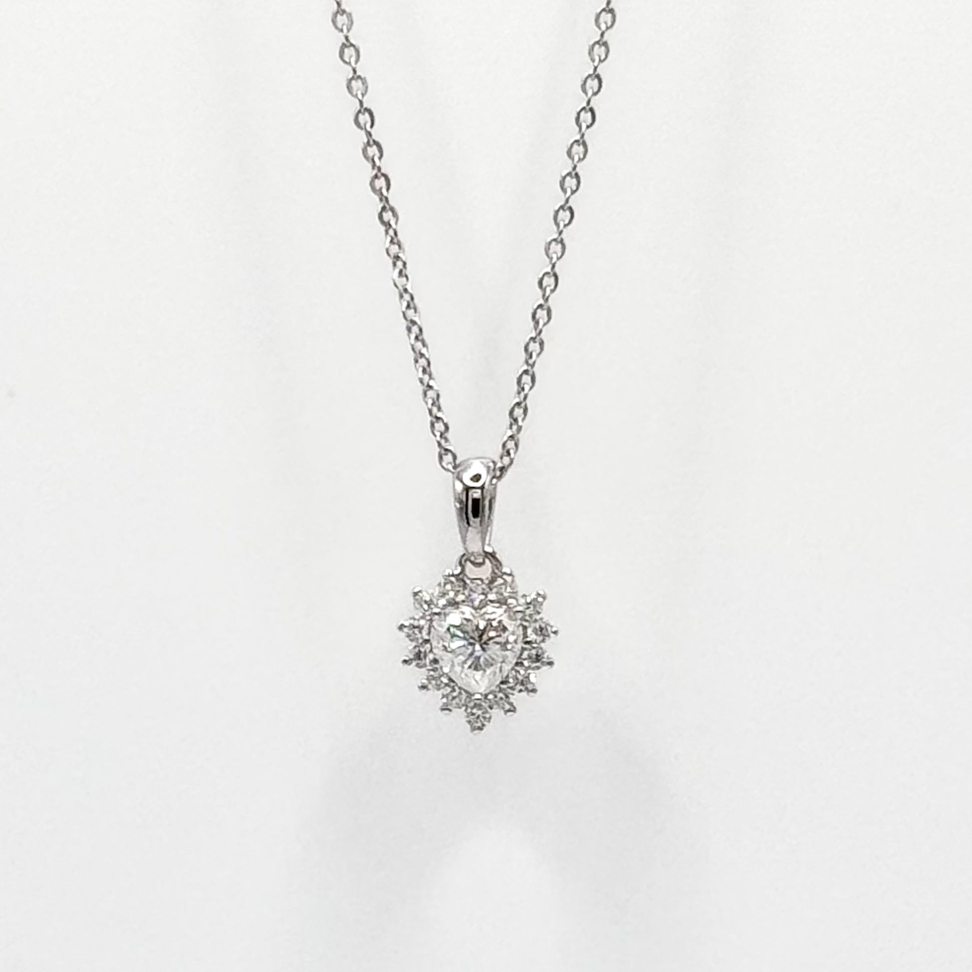 Silver-tone necklace with heart pendant and faceted stones on link chain
