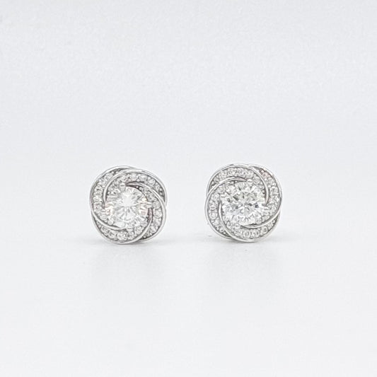 Floral moissanite stud earrings, round center stones in silver halo settings