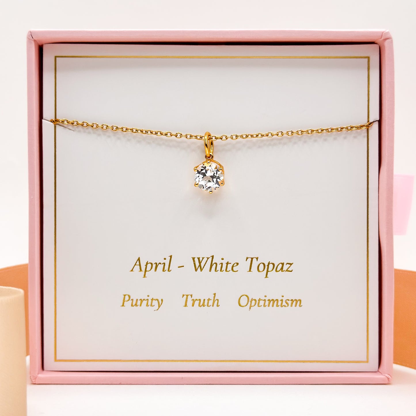 Gold-tone chain necklace with round white topaz pendant