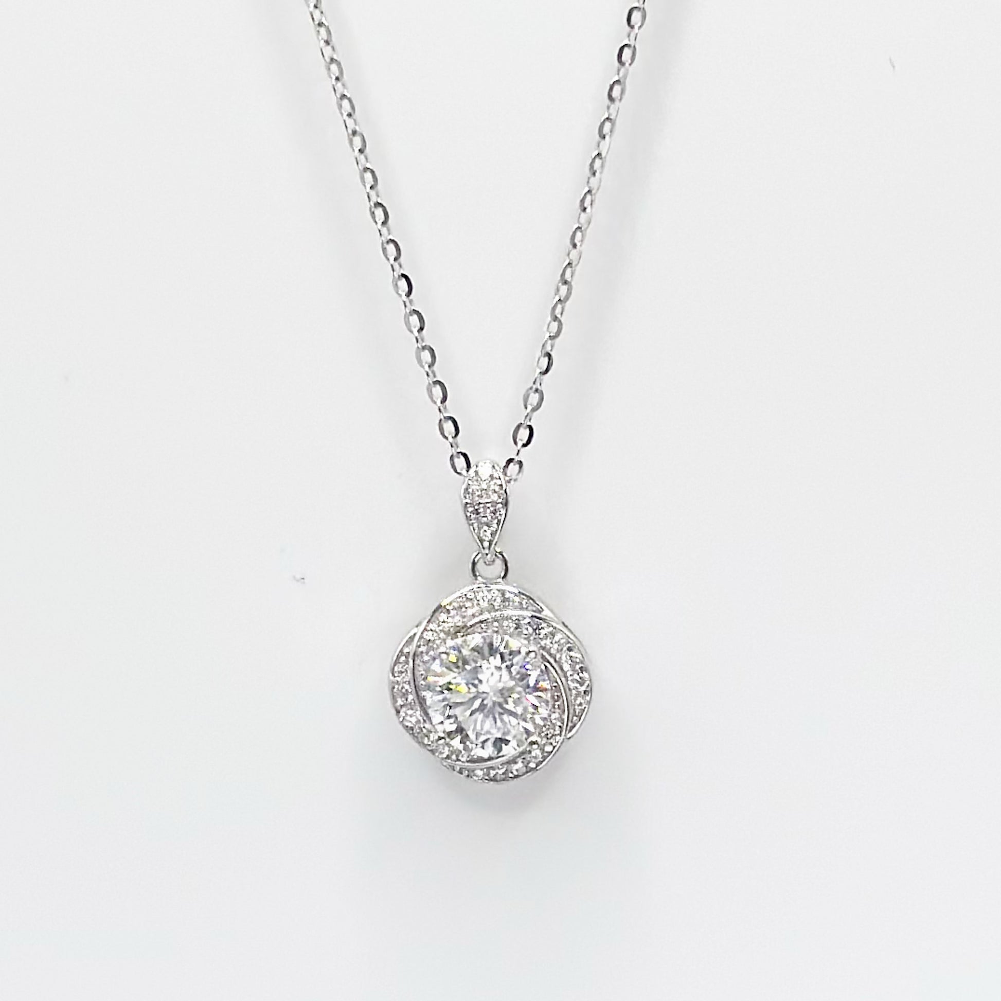 Moissanite floral pendant necklace with round halo center, silver-tone chain
