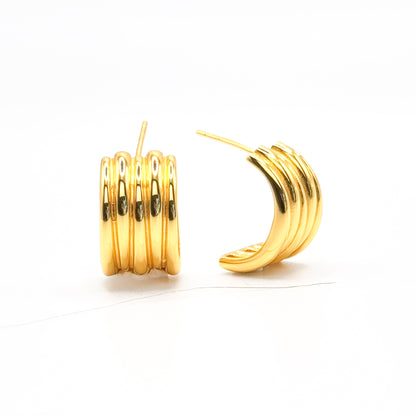 Gold-tone chunky half hoop earrings with ribbed stacked bands, pair view