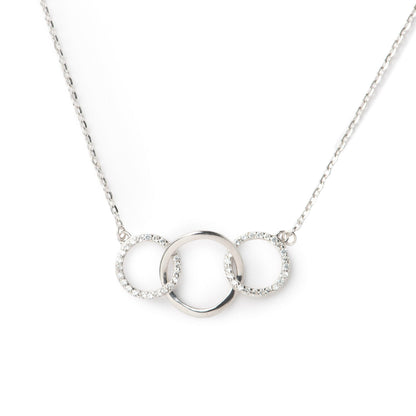 Close-up three-ring pendant necklace on a silver-tone chain