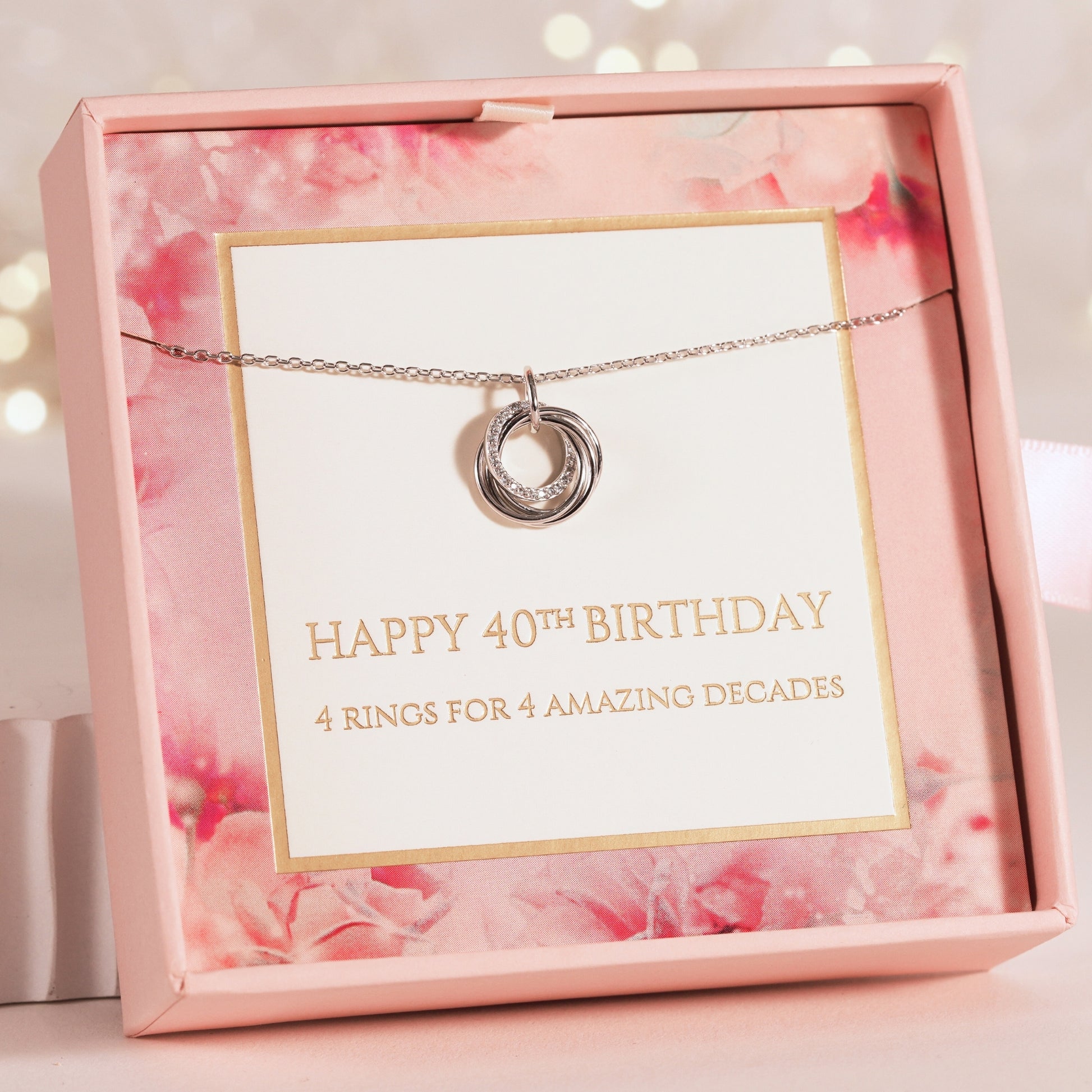 Silver necklace with a pendant in a pink gift box with a birthday message