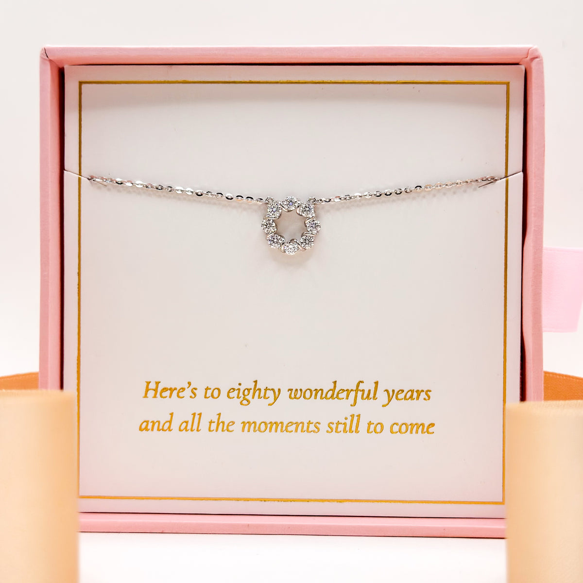 Silver-tone necklace with small chain and heart-shaped gem pendant