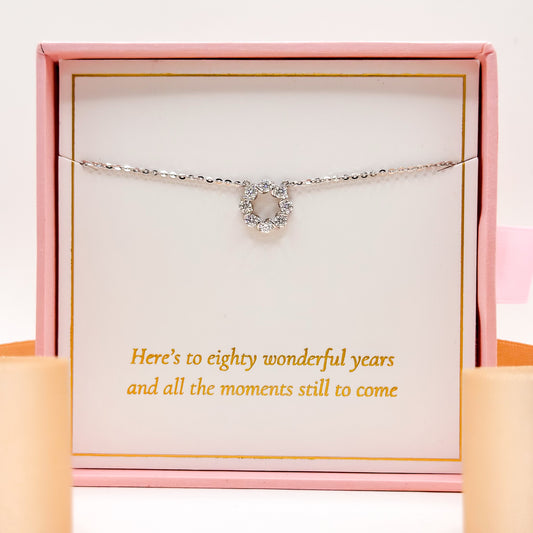 Silver-tone necklace with small chain and heart-shaped gem pendant