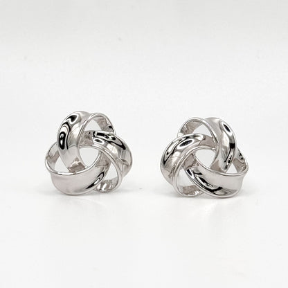 Chunky knot sterling silver hoop earrings with polished swirl design