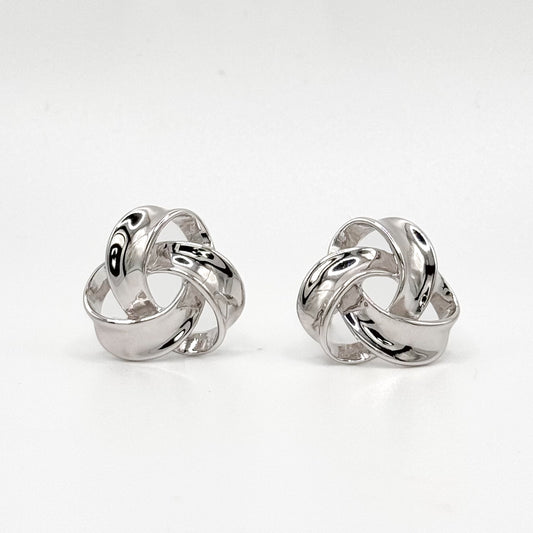 Chunky knot sterling silver hoop earrings with polished swirl design