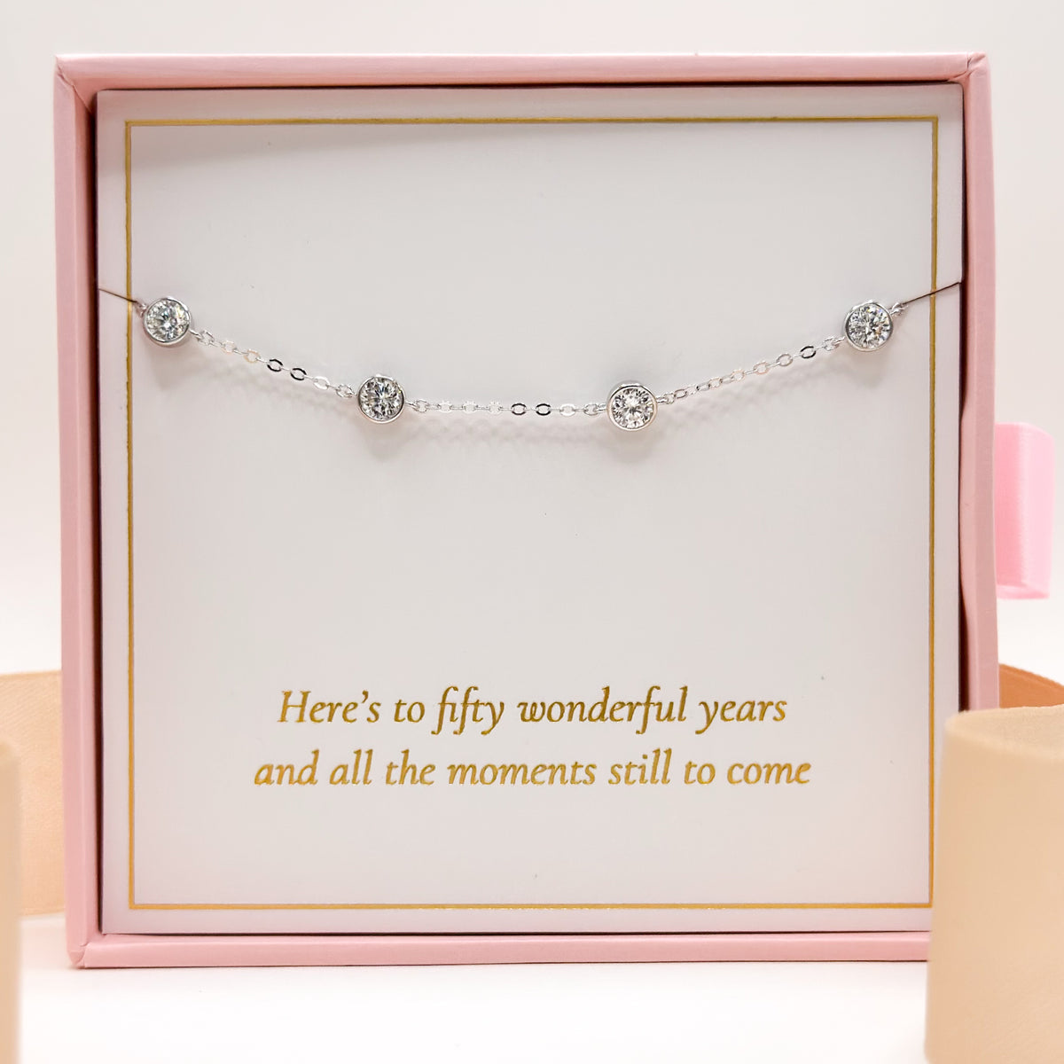 Silver-tone bracelet with five round crystal gems in gift box