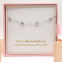 Silver-tone bracelet with five round crystal gems in gift box