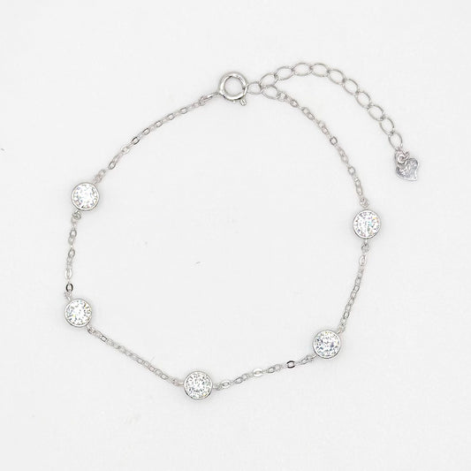 Silver-toned moissanite bracelet with five round bezel-set stones