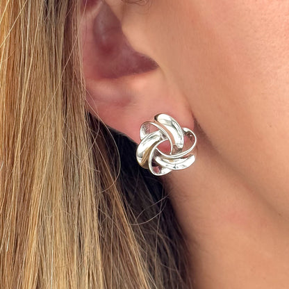 Chunky sterling silver knot stud earrings with polished twist design