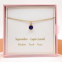 Gold chain necklace with round blue lapis lazuli birthstone pendant