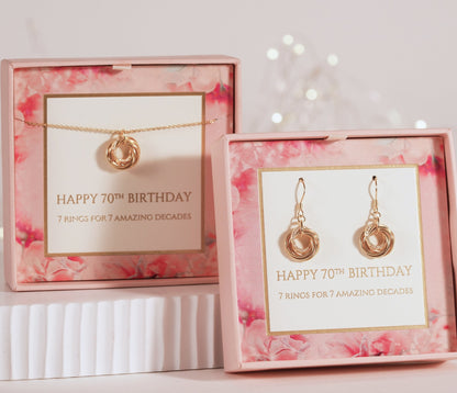 Gold-tone ring-charm drop earrings shown in gift box