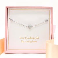 Sterling silver heart charm bracelet with small round crystal accents