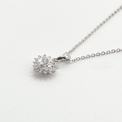 Silver-tone pendant with faceted stone centerpiece and hinged bail on chain