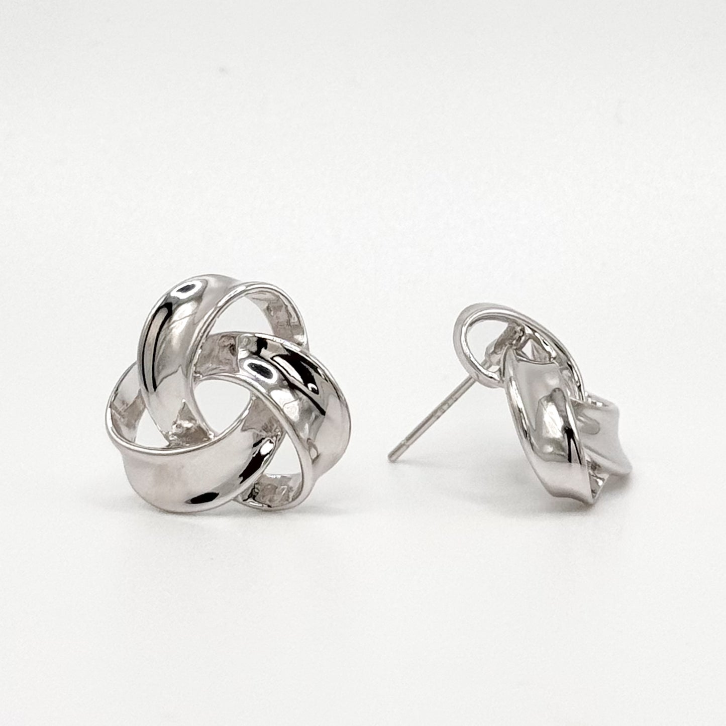 Chunky knot sterling silver earrings with open loop design and post backing