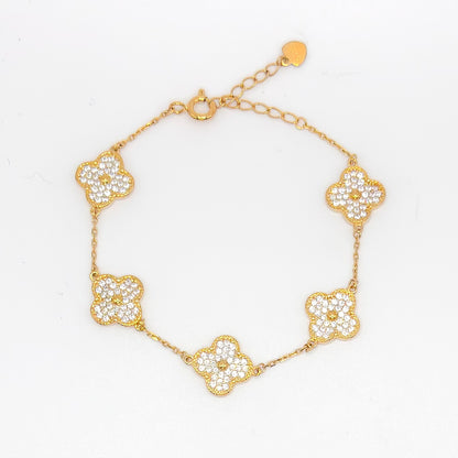 Gold clover bracelet with five small pave flower charms and link chain.
