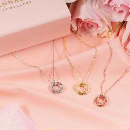 Rings necklace set with silver, gold, and rose gold interlocking ring pendants