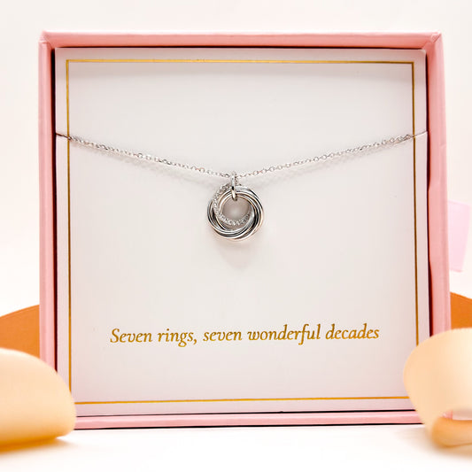 Silver tone necklace with round layered ring pendant and fine chain