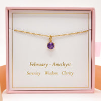 Gold-tone amethyst pendant necklace with small purple round gemstone