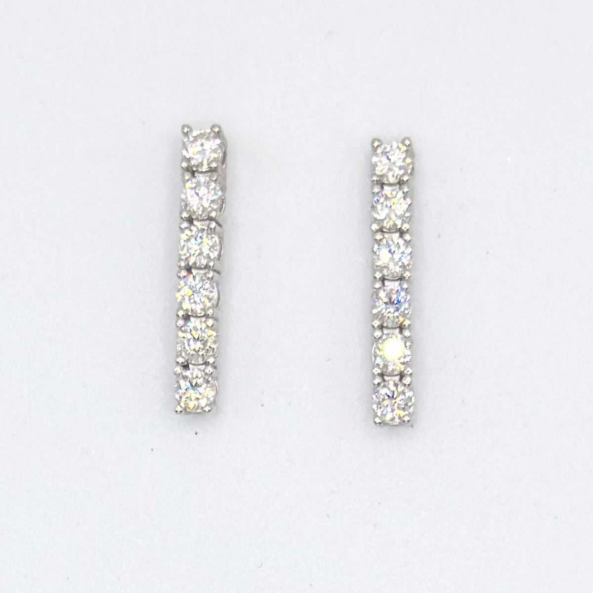 Moissanite tennis drop earrings with six-stone linear design