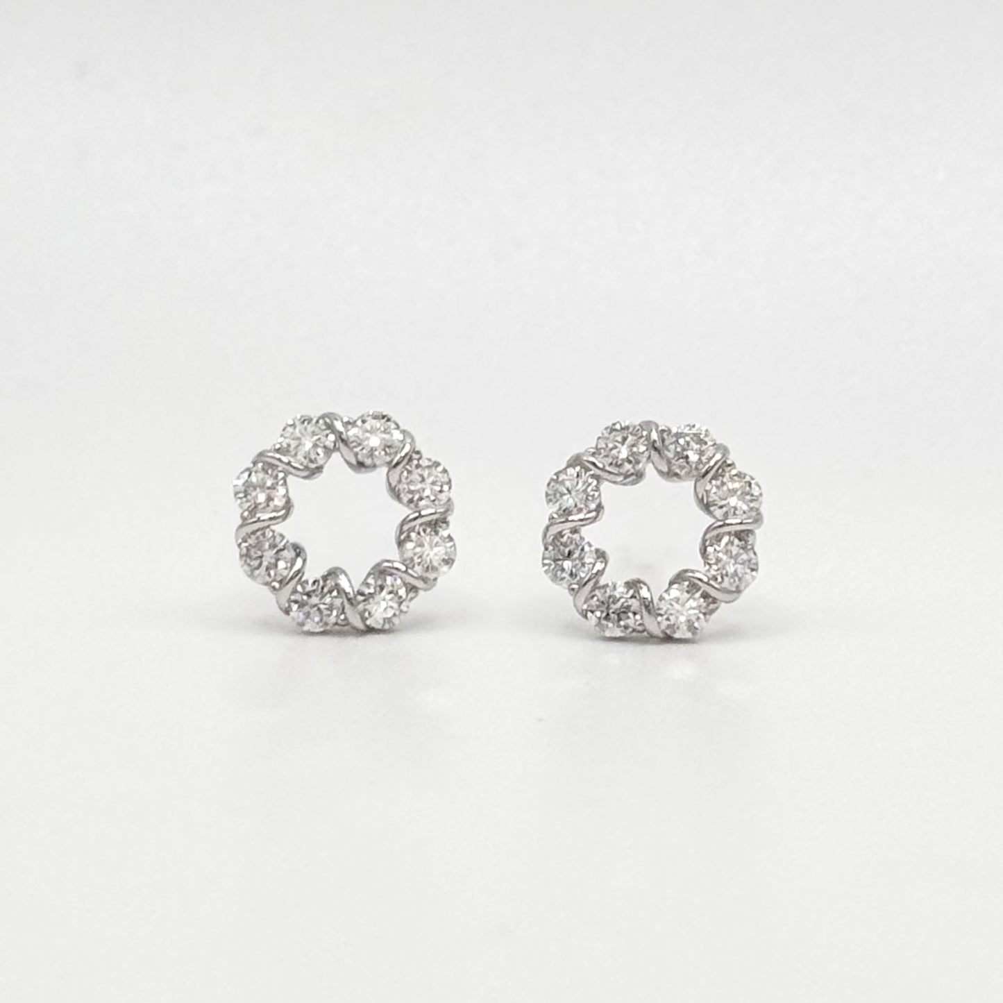 Circle moissanite stud earrings with round crystal stones, silver-tone settings