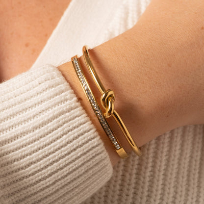 Gold hinged crystal bangle on wrist, open hinge detail with crystal trim