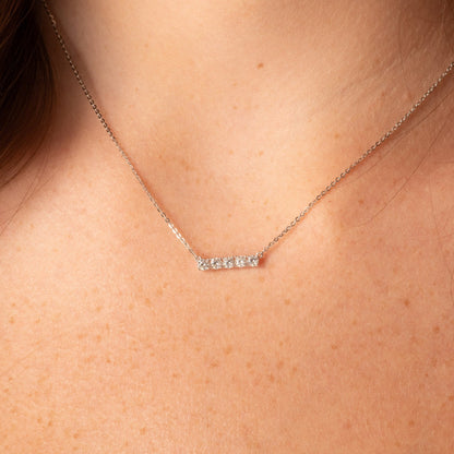 Silver-tone bar pendant necklace with small round crystals and bar centerpiece