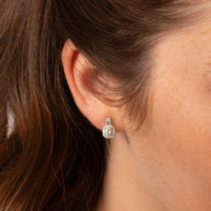 Lab-grown moissanite stud earring with teardrop center and glittering halo setting