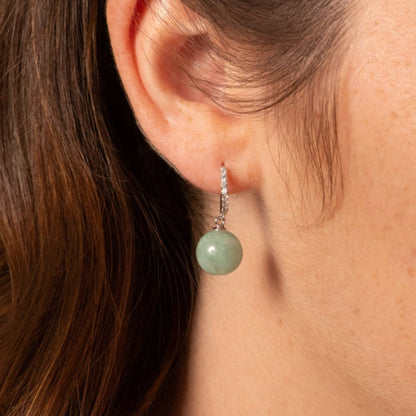Pave silver-tone huggie hoop earring with round green jade charm dangling