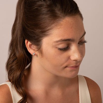 925 sterling silver stud earring with round clear stone worn on ear