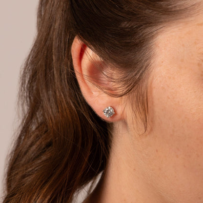 925 sterling silver stud earring with round clear stone on ear, push-back