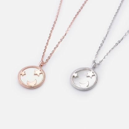 Moon and star pendant necklaces in rose gold and silver with round pendants