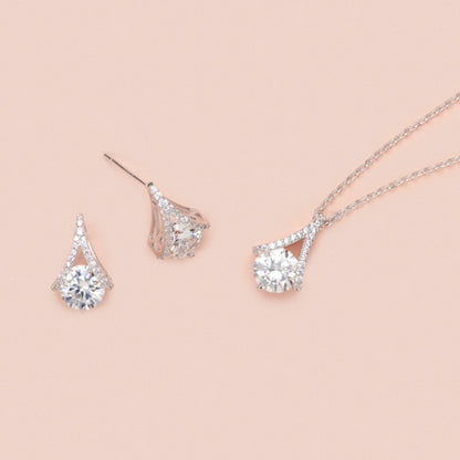 Teardrop diamond earrings set, pear-shaped stones on metal studs