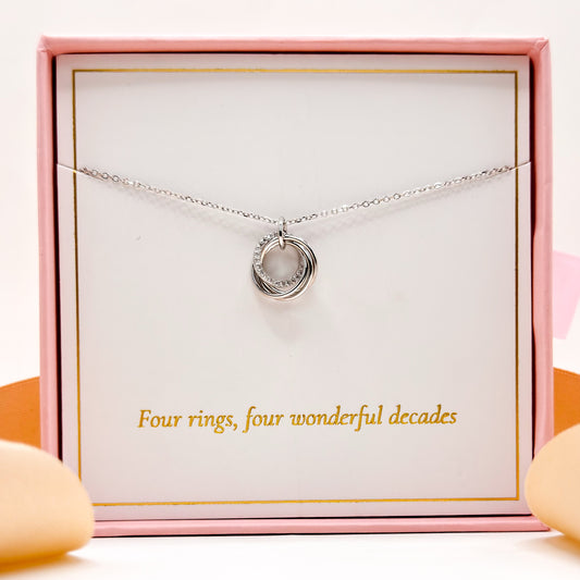 Silver 40th birthday necklace with four-ring circular pendant