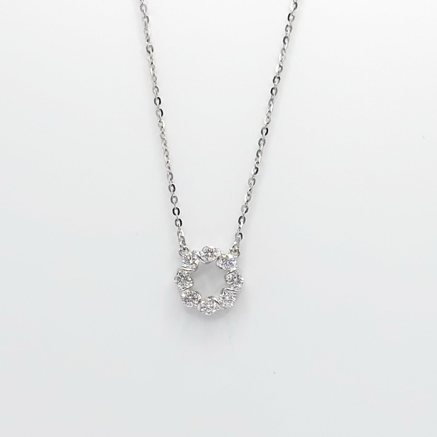 Circle pendant moissanite necklace with silver-tone chain and round stone cluster